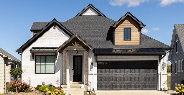 The exterior of a house with white brick facade.