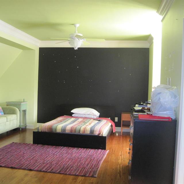 Bedroom with black accent wall