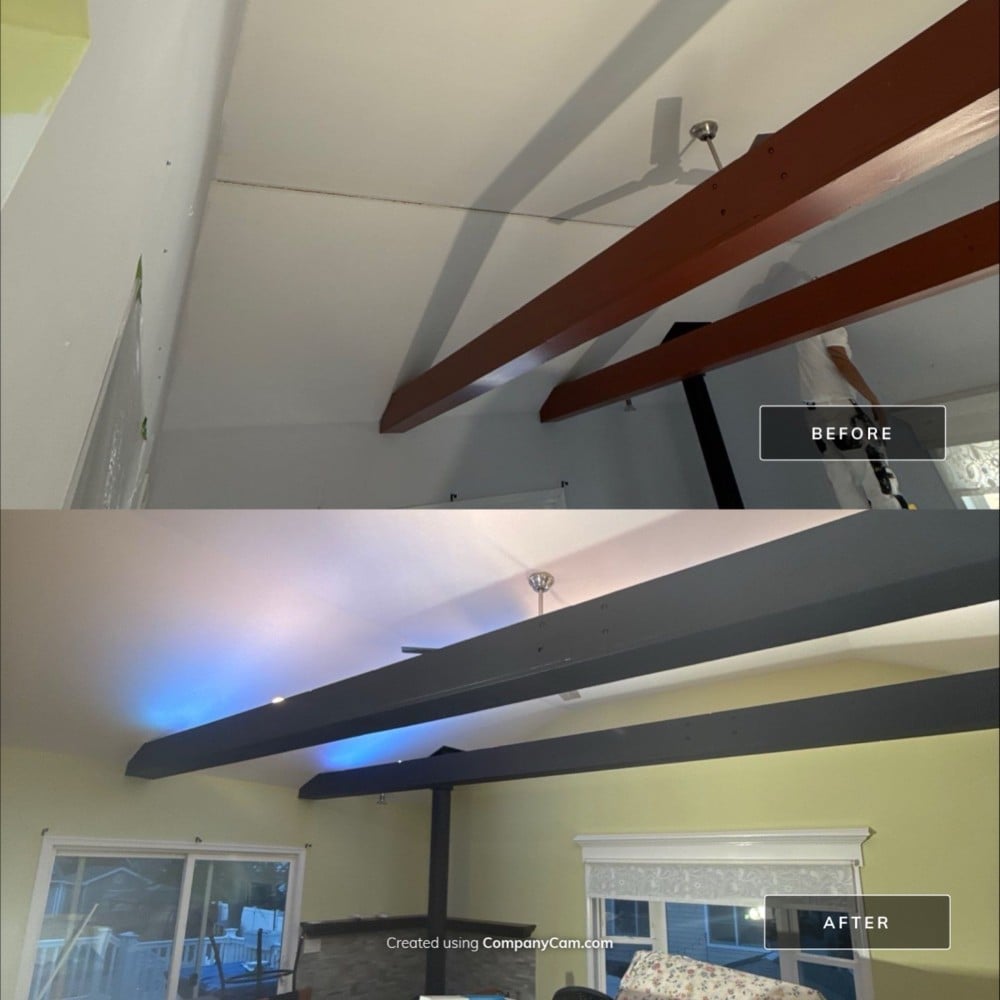 Before and after of interior ceiling beam repaint. Original wood finish updated to sleek charcoal for a bold modernized room accent.
