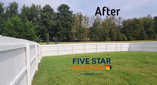 Completed white painted fence project in back yard