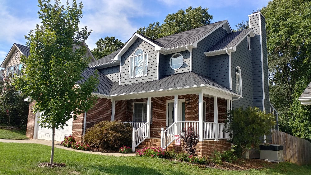 Exterior repaint color change from tan to gray on siding