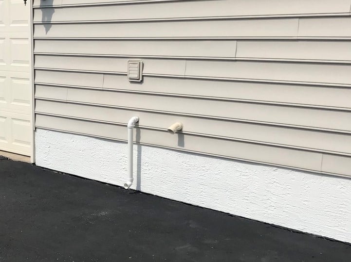 home foundation white stucco repainted beige home