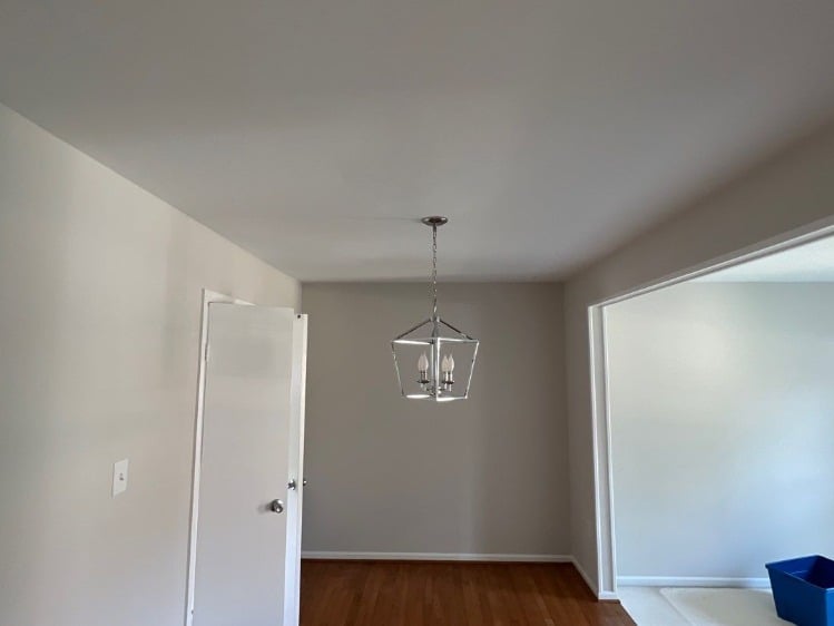 Grey Renewed Grey Dining Room with Contrasting White Trim and New Chrome Lighting.