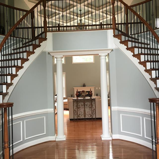 Interior painting entry stairway and columns gray walls white trim