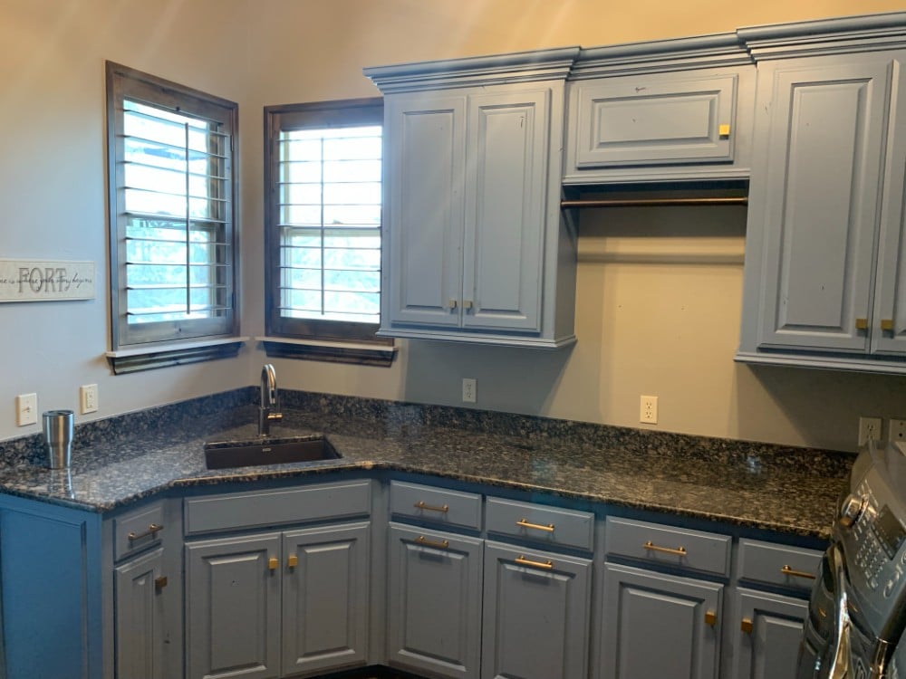 Laundry room cabinet repaint. Color: Sherwin Williams - Smokey Azurite (blue)