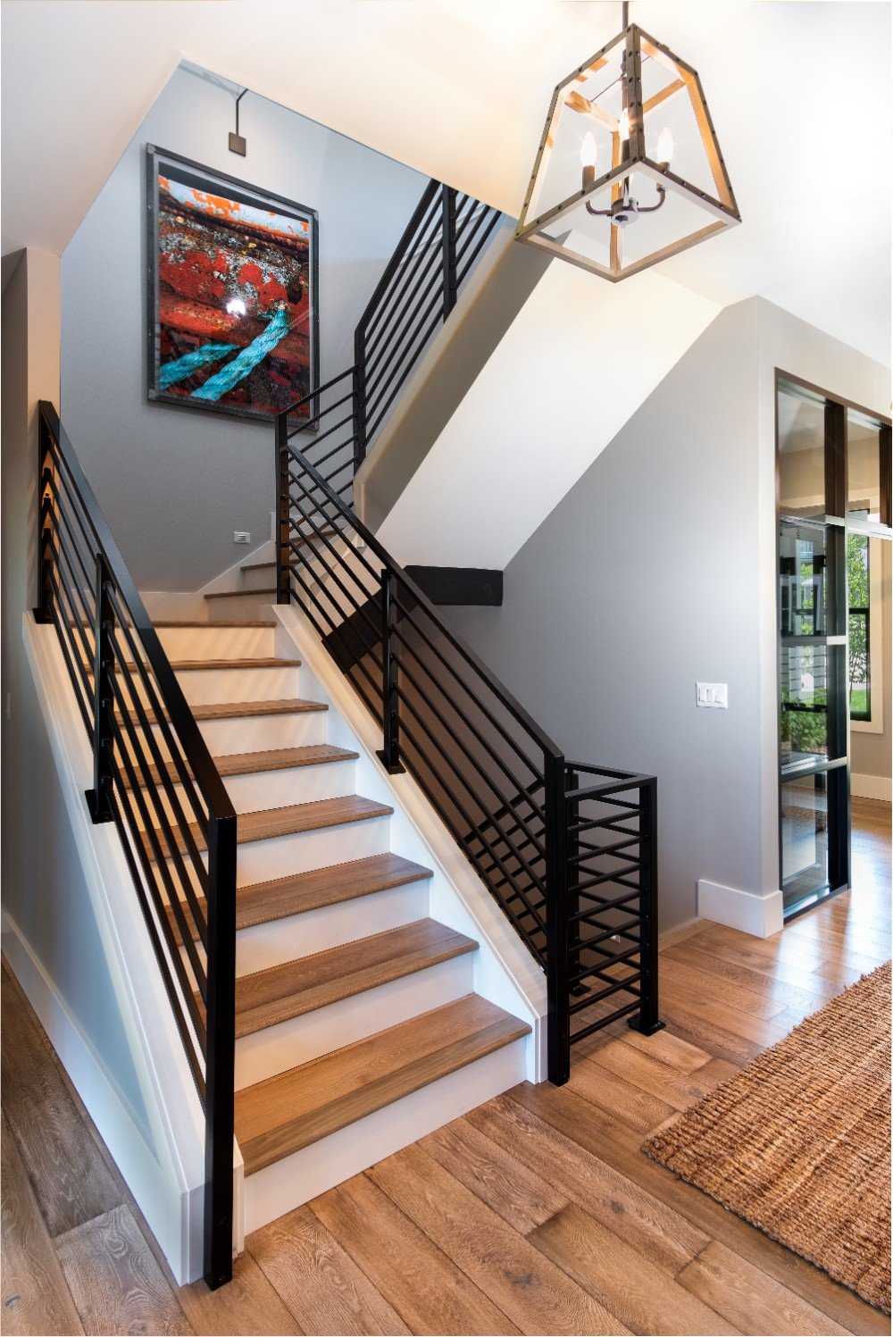Transformed stairway and walls showcasing expertly painted surfaces, reflecting the superior craftsmanship of our Five Star Painting services in Wexford, PA.