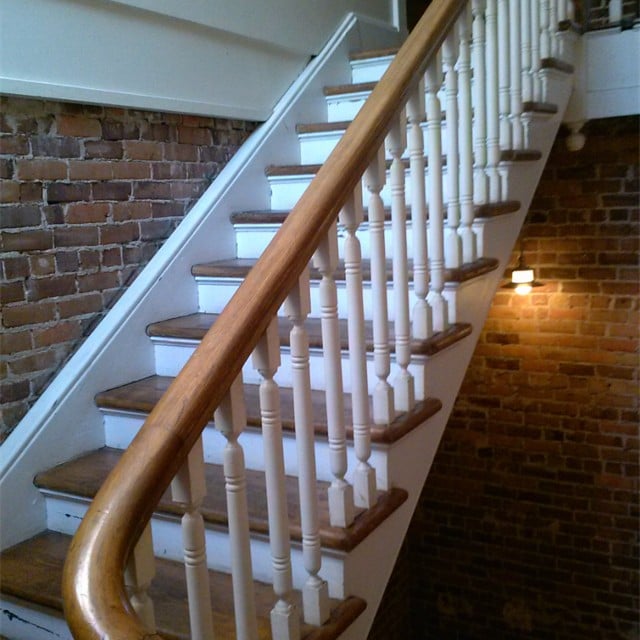 Staircase with wooden rail