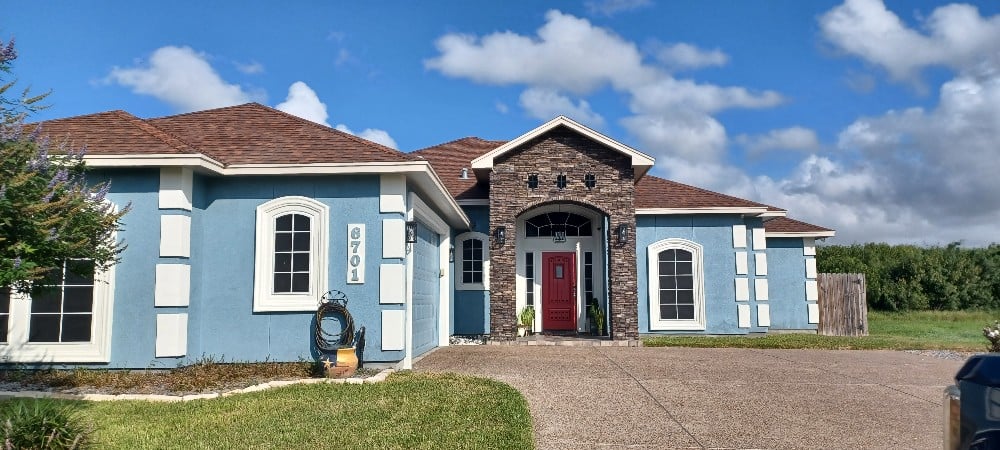 Stucco and Stucco Home done is Sherwin Williams. Body is Poolhouse with Dover White Fascia Trim and Shiitake Soffit. The front door is Sherwin Williams Antique Red