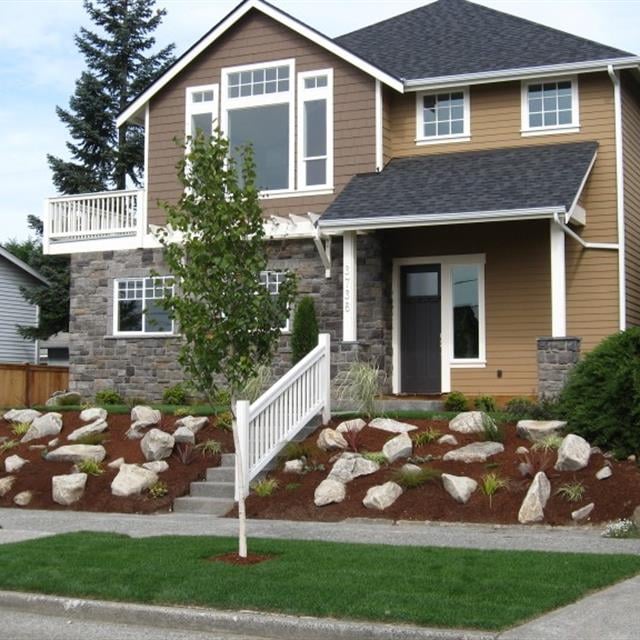 exterior of home with updated paint and landscaping