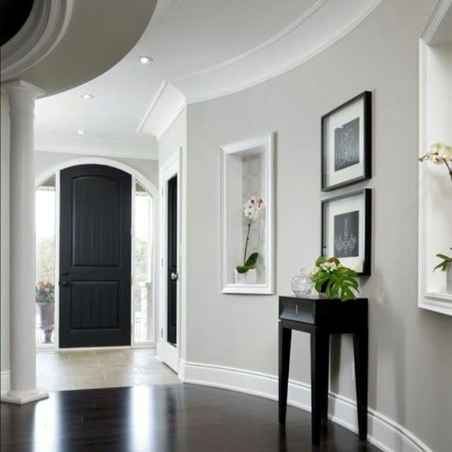 foyer with curved walls and updated grey paint