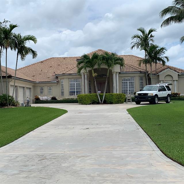 house at the end of a long driveway