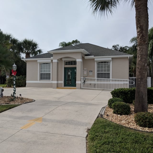 tan house with driveway