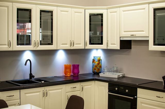 white kitchen cabinets and black counters