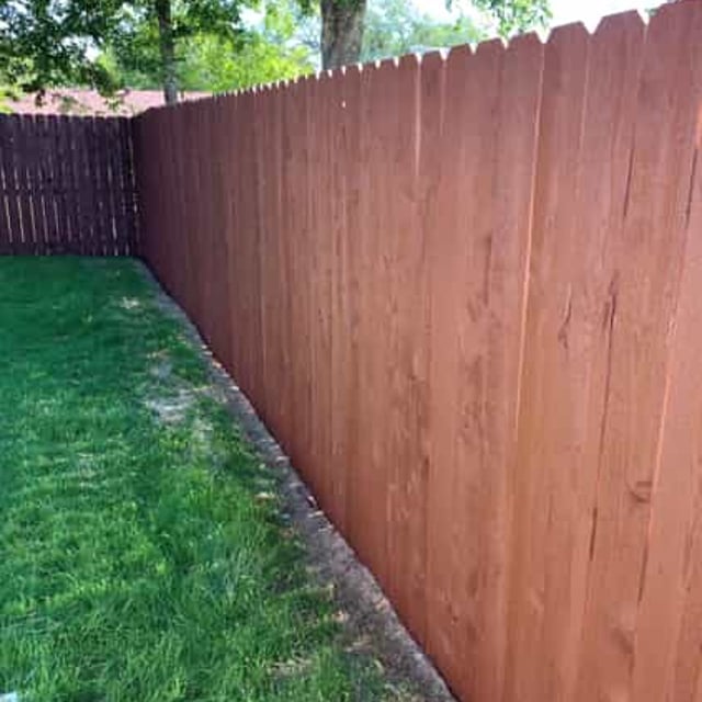 wood fence and grass lawn 