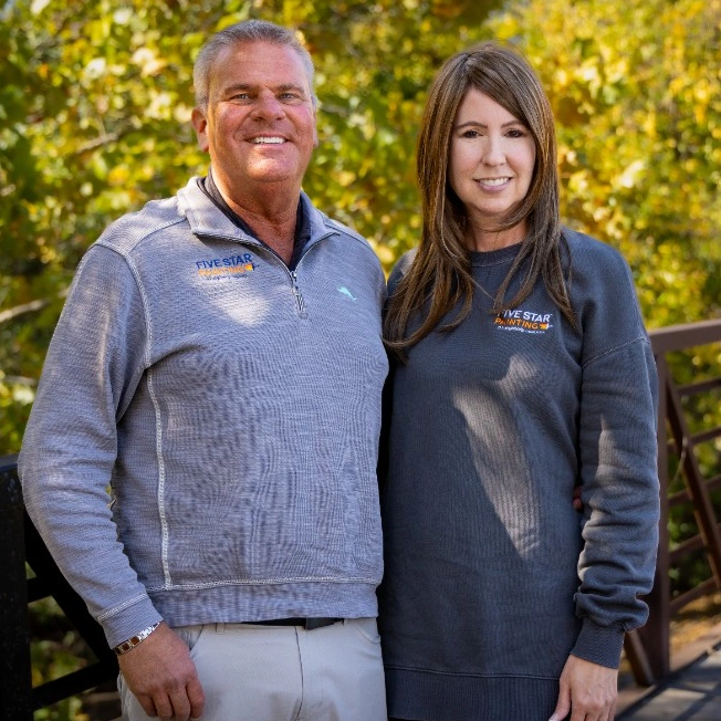 Five Star Painting professional shaking hands with a customer.