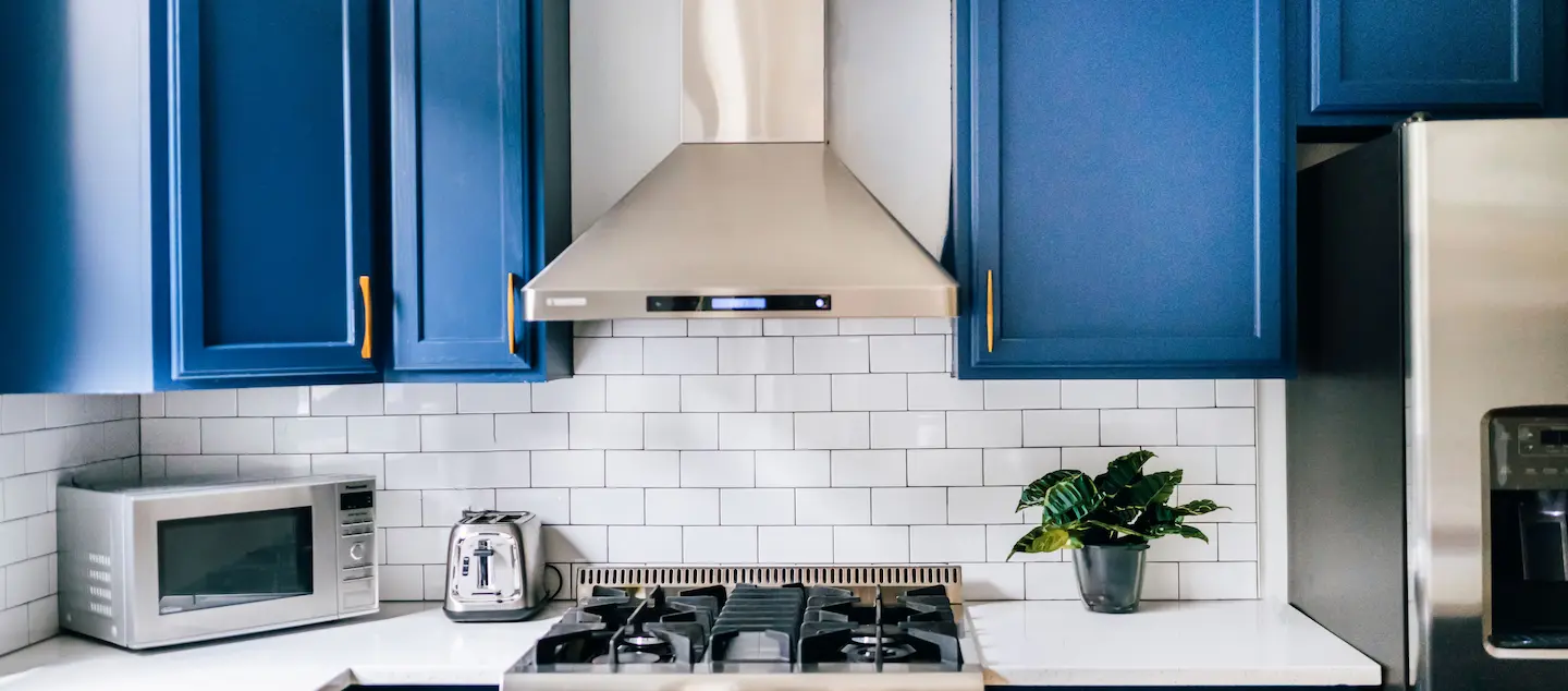 Blue painted kitchen cabinets.