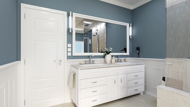 Updated bathroom with teal colored walls.