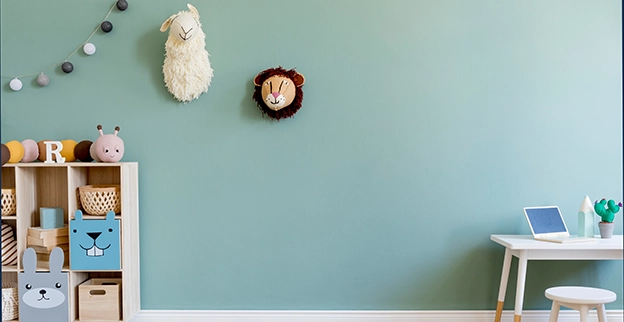Kids bedroom with wood floor and turquoise painted walls.