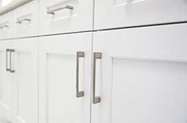White cabinet doors with silver pulls.