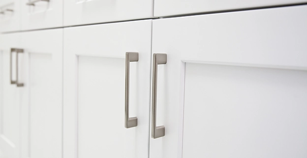 White cabinet doors with silver pulls.