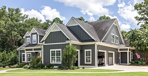 Exterior of a home painted a dark grey color.