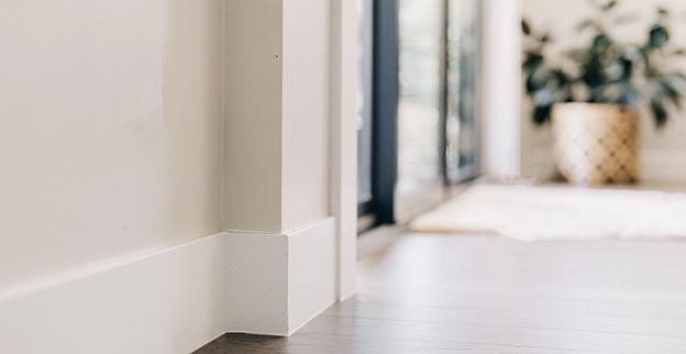 White painted trim on the inside of a home.