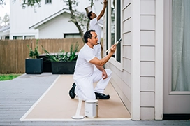 Five Star Painting professional painting wood siding on the exterior of a home.