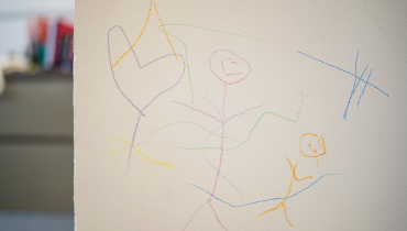 Crayon drawings on white walls