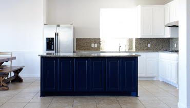 Blog title superimposed over a photo of a warm, orange accented kitchen, Five Star Painting logo in the top right