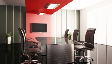Photo of a sleek-looking, black and red meeting room