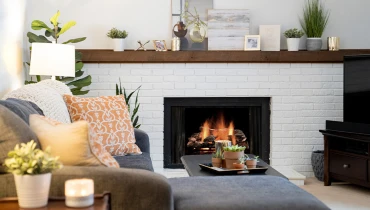 Cozy living room with sofa and fireplace