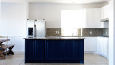 Photo of a large kitchen with white cabinets
