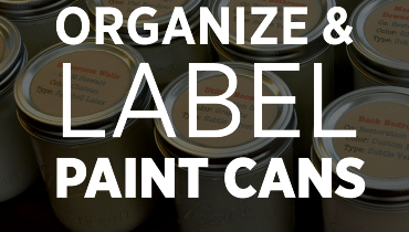 Paint cans neatly organized and labeled.