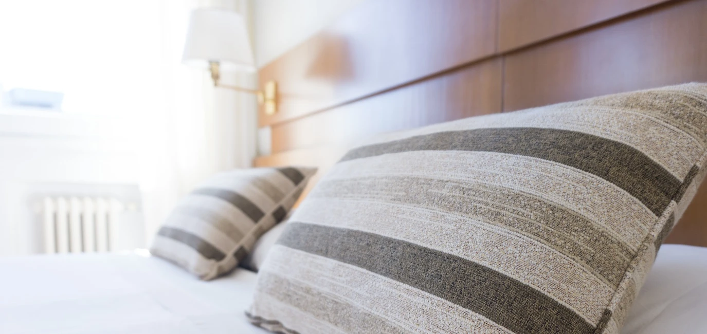 Striped pillows on a bed.