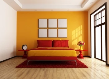 A cozy bedroom with sunny yellow walls and vibrant red bedding.